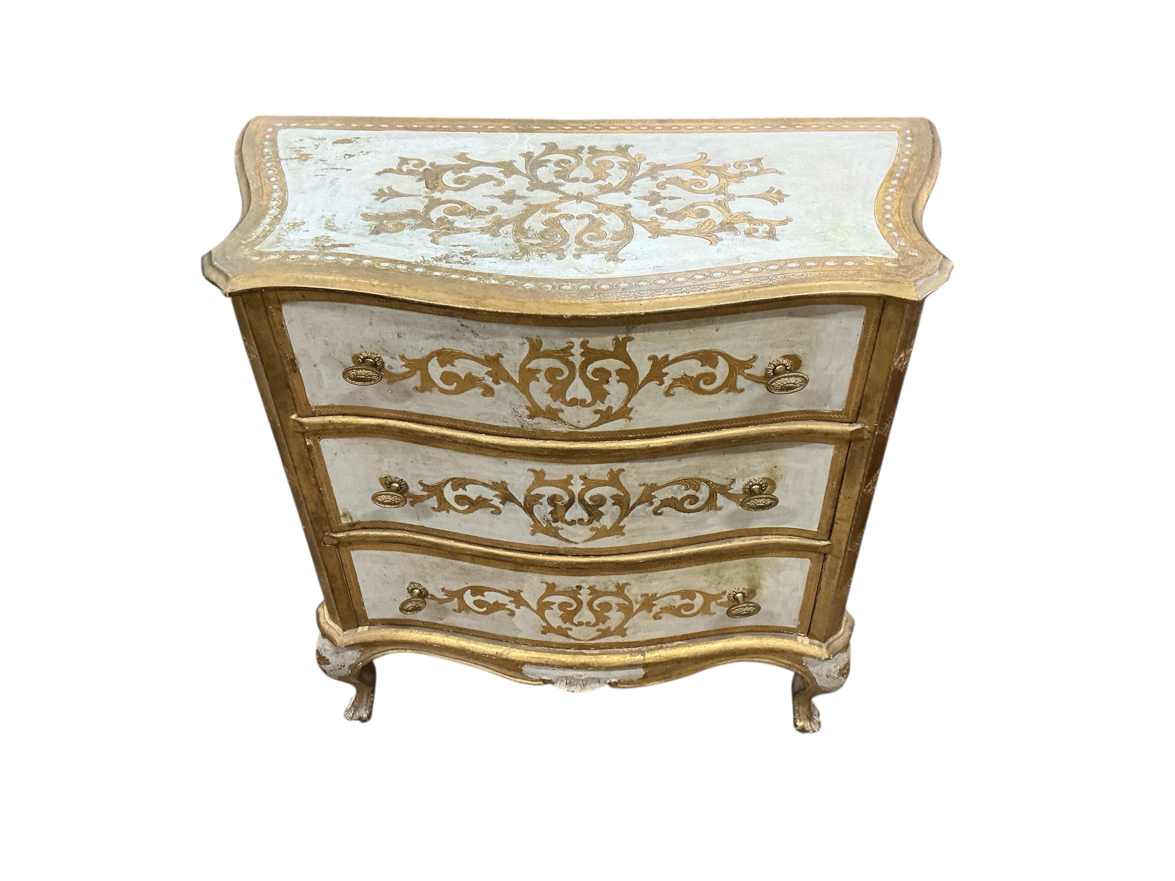 A pair of Northern Italian parcelgilt serpentine three drawer bedside chests, width 69cm, depth 38cm, height 78cm